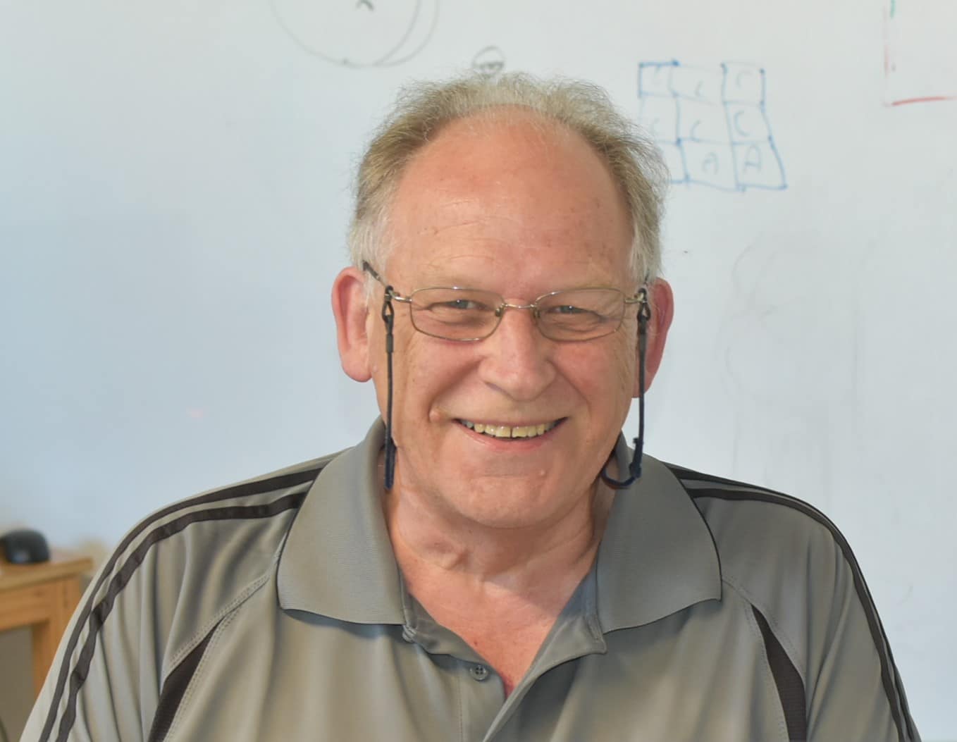 Howard Woolston – Casual smiling photo of Howard Woolston, one of the owners of Smartway Builders.